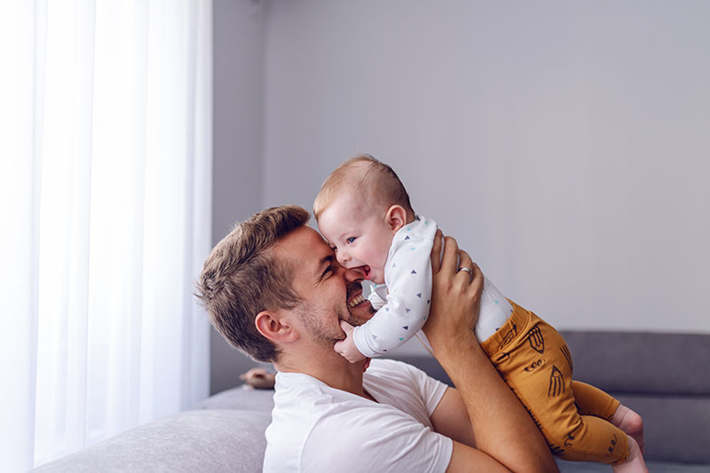 single father with young happy baby